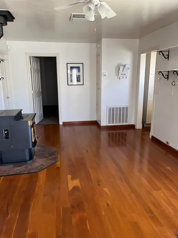 a view of a livingroom with wooden floor