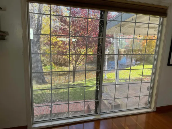 a view of a gate and a window