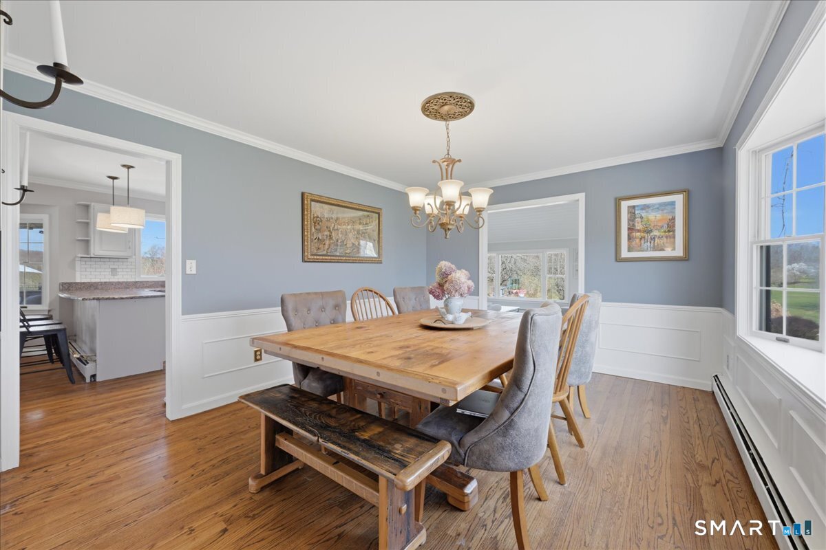 792 Wrights Crossing Road Pomfret, CT 06259 - Photo 13 of 40 a view of a dining room with furniture window and wooden floor