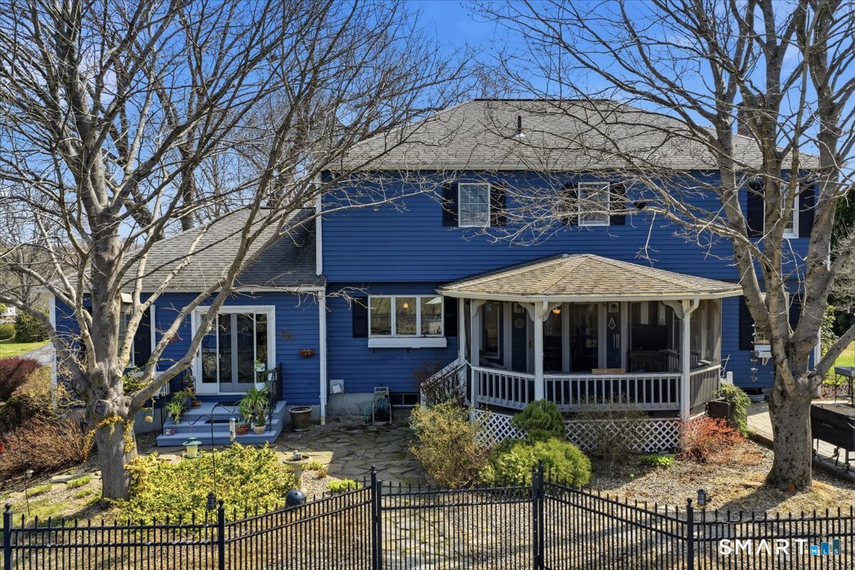 792 Wrights Crossing Road Pomfret, CT 06259 - Photo 2 of 40 a view of a house with a iron fence