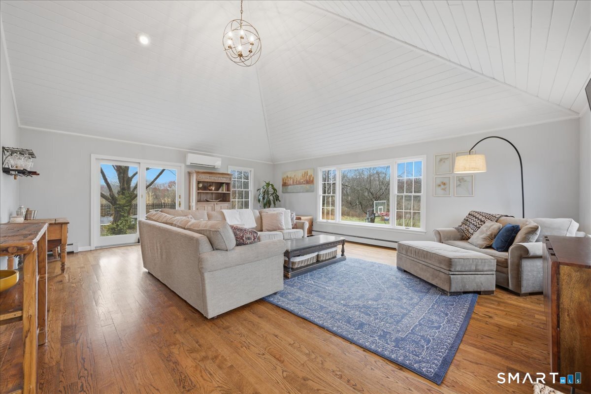 792 Wrights Crossing Road Pomfret, CT 06259 - Photo 22 of 40 a living room with furniture and a large window