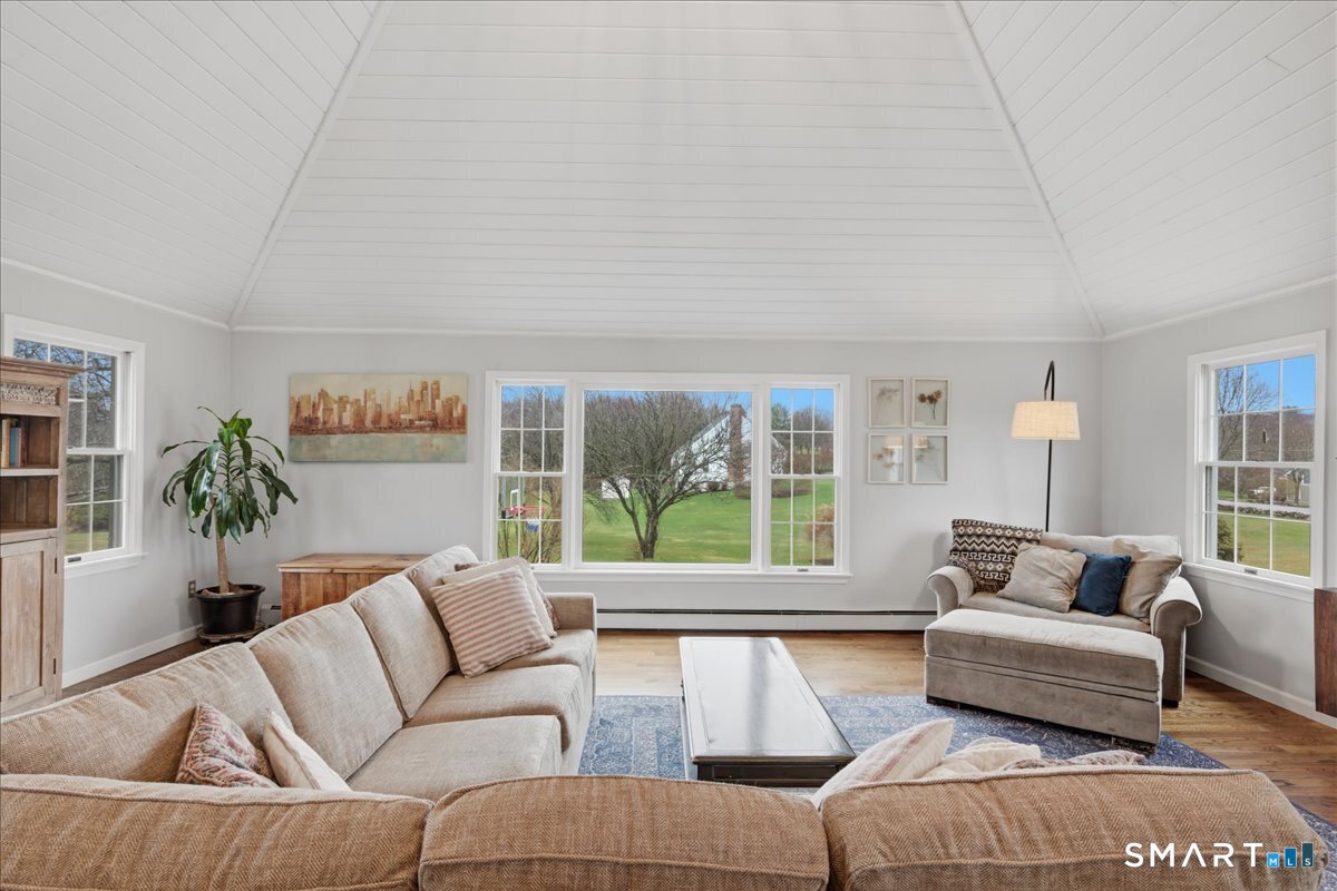 792 Wrights Crossing Road Pomfret, CT 06259 - Photo 23 of 40 a living room with furniture and a large window