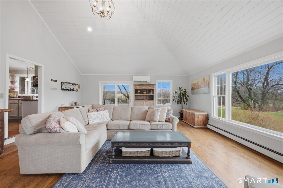 792 Wrights Crossing Road Pomfret, CT 06259 - Photo 26 of 40 a living room with furniture and a large window