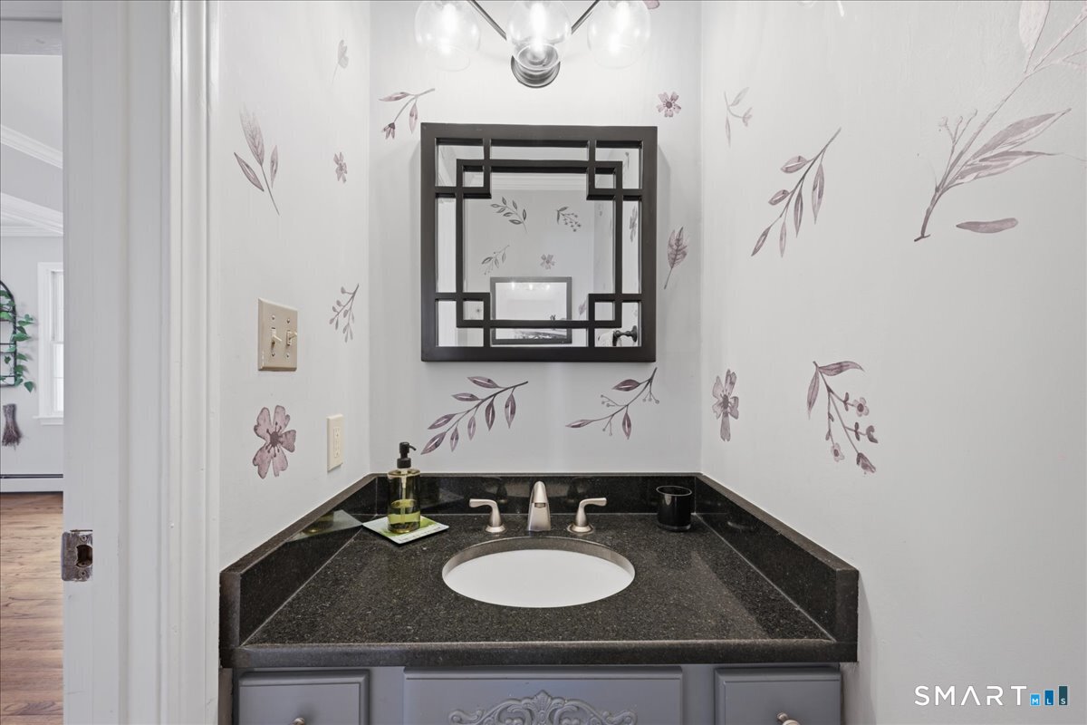 792 Wrights Crossing Road Pomfret, CT 06259 - Photo 28 of 40 a bathroom with a sink and a mirror