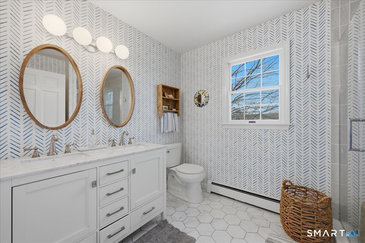 792 Wrights Crossing Road Pomfret, CT 06259 - Photo 30 of 40 a bathroom with a toilet a sink and mirror