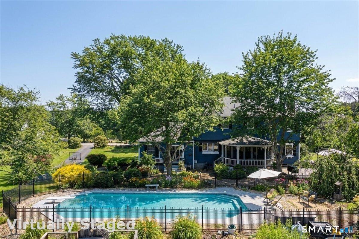 792 Wrights Crossing Road Pomfret, CT 06259 - Photo 3 of 40 a front view of a house with garden