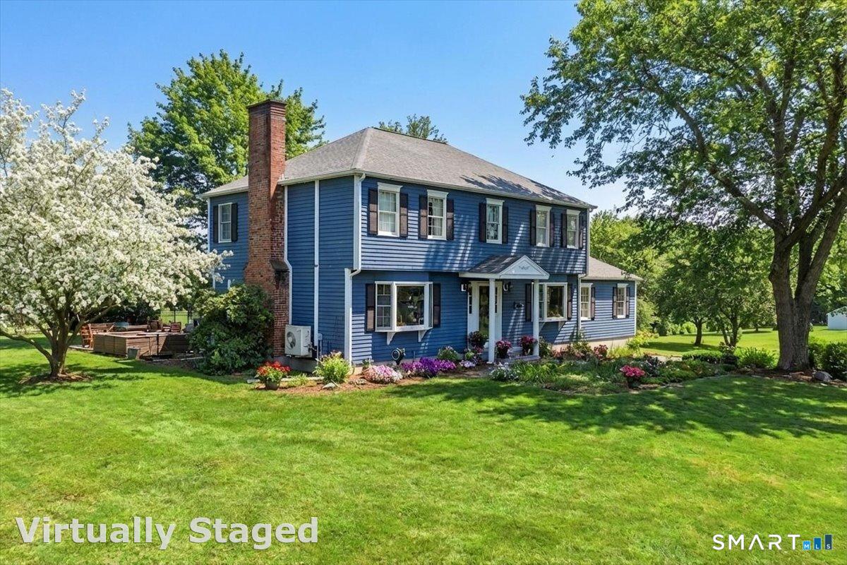 792 Wrights Crossing Road Pomfret, CT 06259 - Photo 37 of 40 a front view of a house with garden