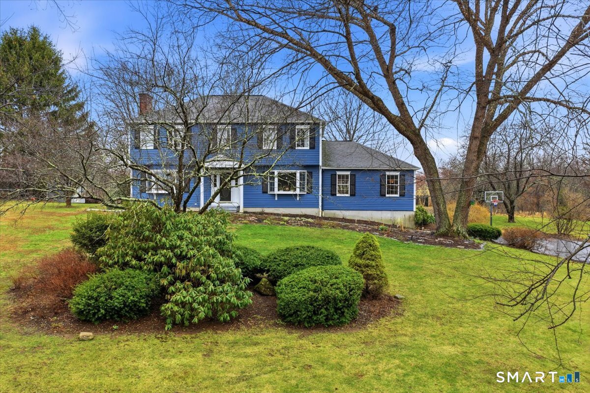 792 Wrights Crossing Road Pomfret, CT 06259 - Photo 8 of 40 a front view of a house with garden