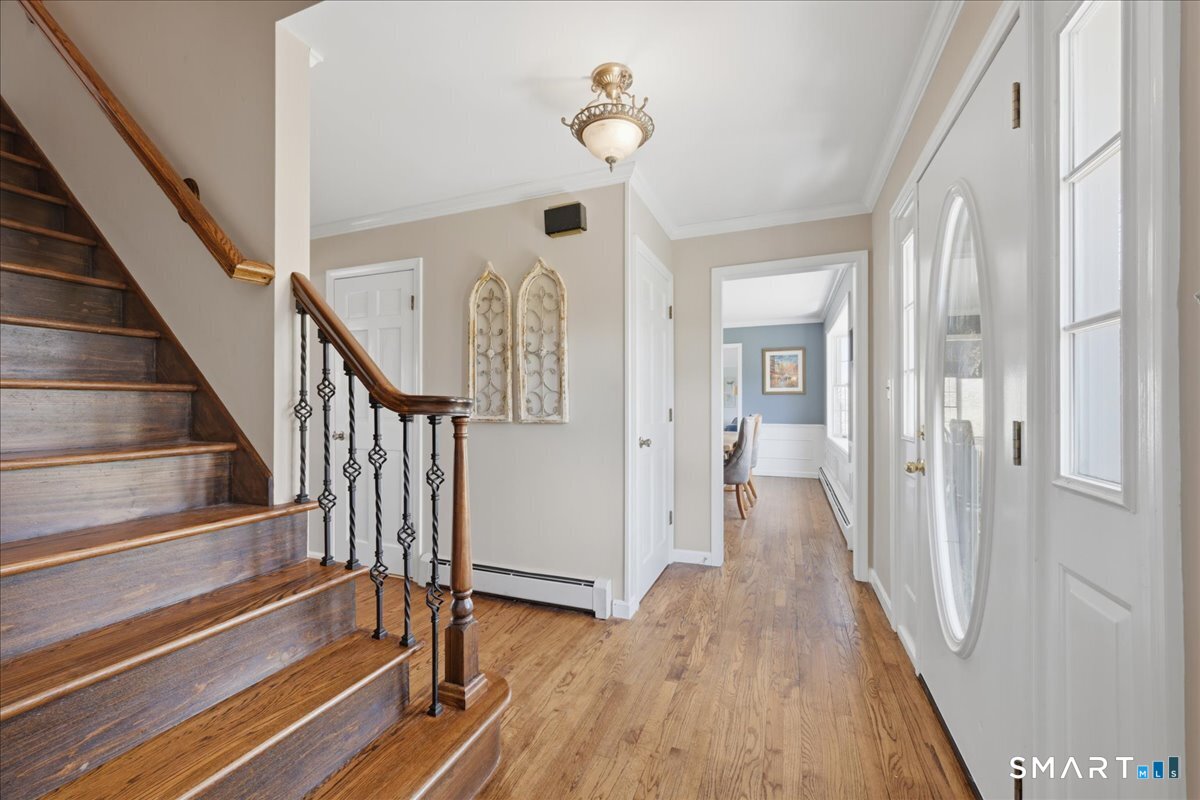 792 Wrights Crossing Road Pomfret, CT 06259 - Photo 10 of 40 a view of a hallway with wooden floor and staircase