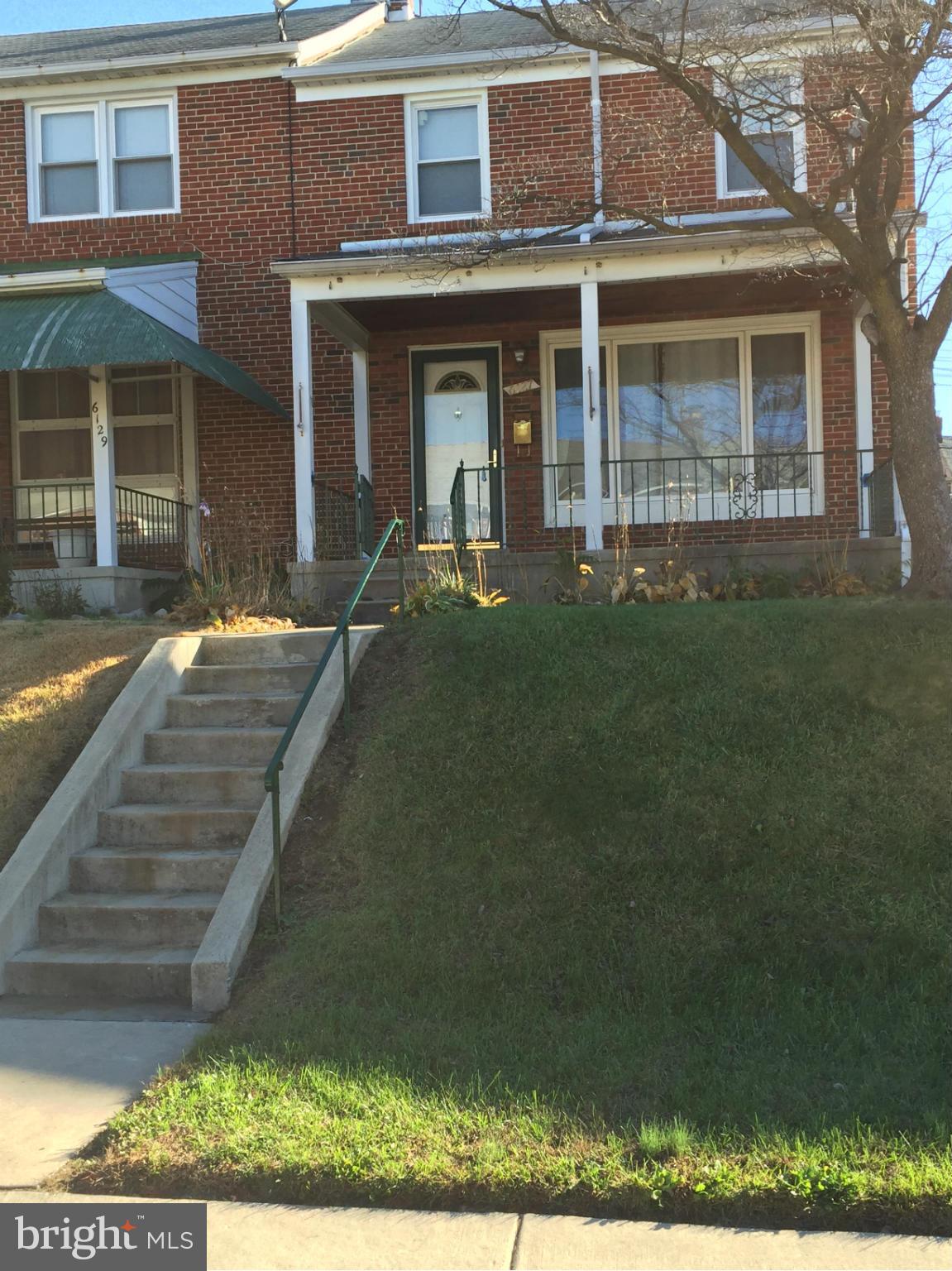 6127 Marlora Road Baltimore, MD 21239 - Photo 2 of 27 a front view of a house with garden