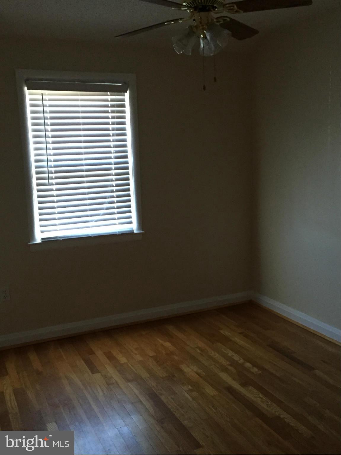6127 Marlora Road Baltimore, MD 21239 - Photo 15 of 27 a view of an empty room with a window