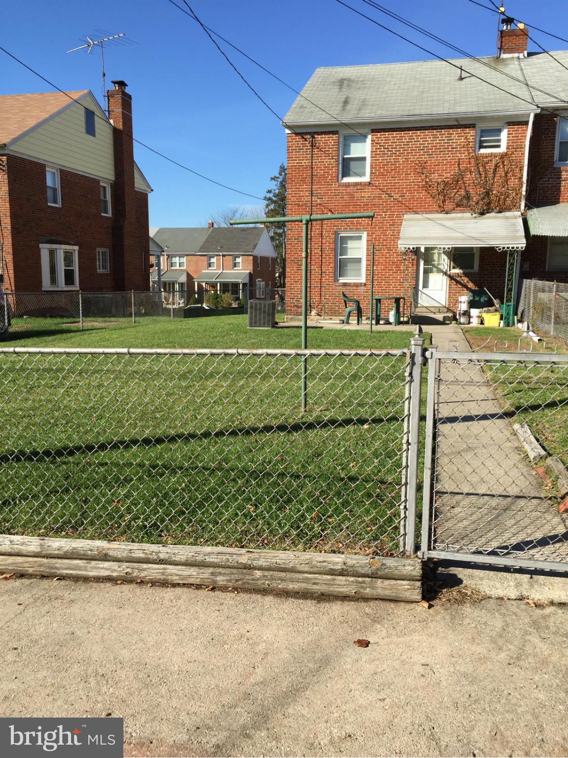 6127 Marlora Road Baltimore, MD 21239 - Photo 27 of 27 a front view of a house with a yard