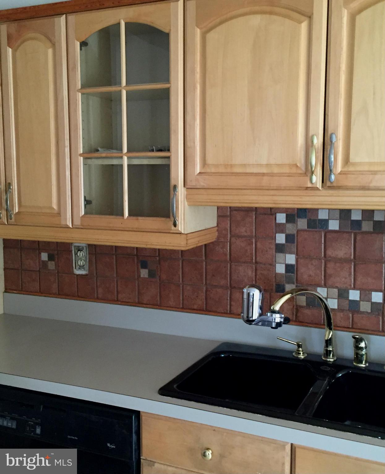 6127 Marlora Road Baltimore, MD 21239 - Photo 10 of 27 a kitchen with a sink and cabinets