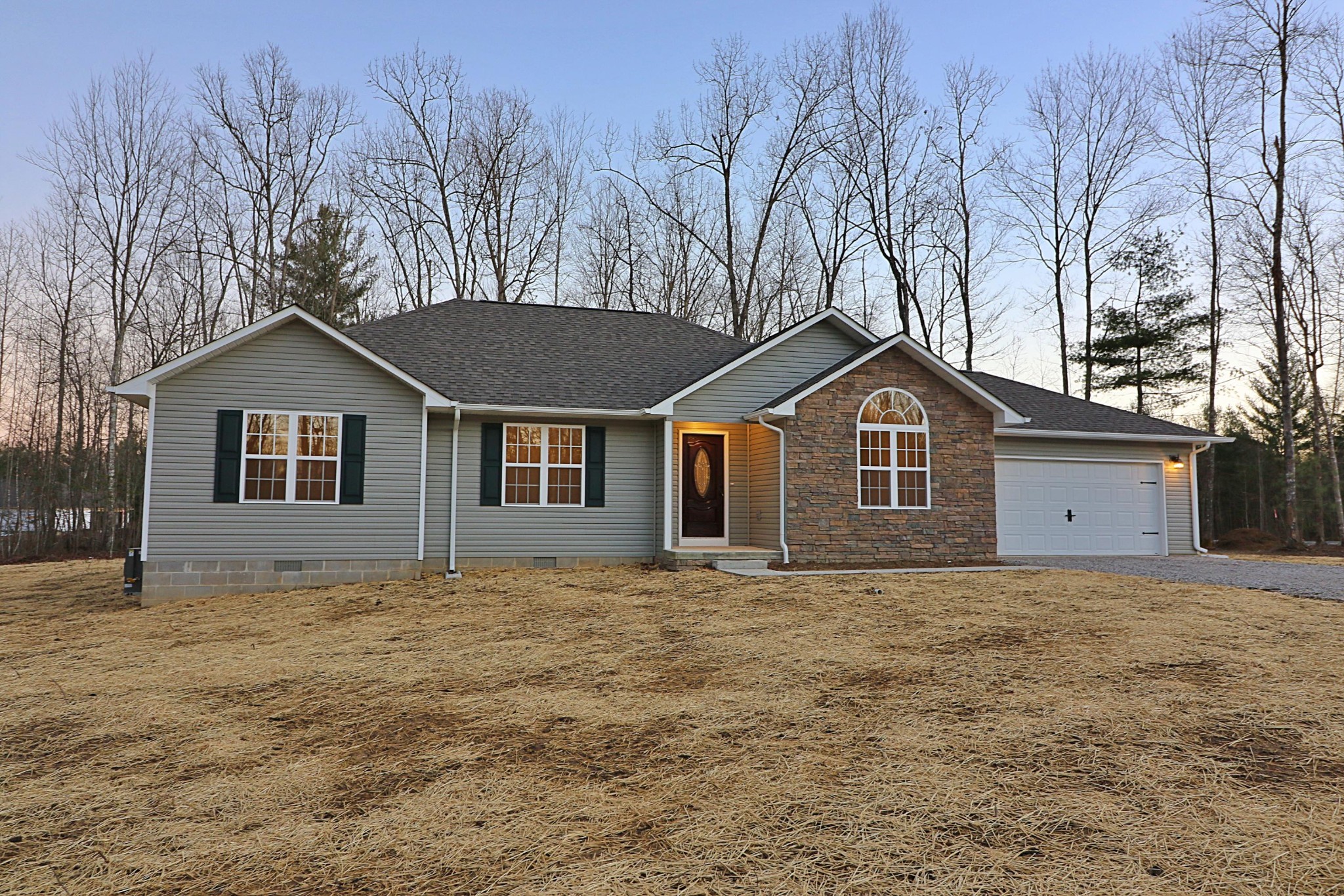 971 Toomey Falls Road Oneida, TN 37841 - Photo 1 of 16 a front view of a house with a yard