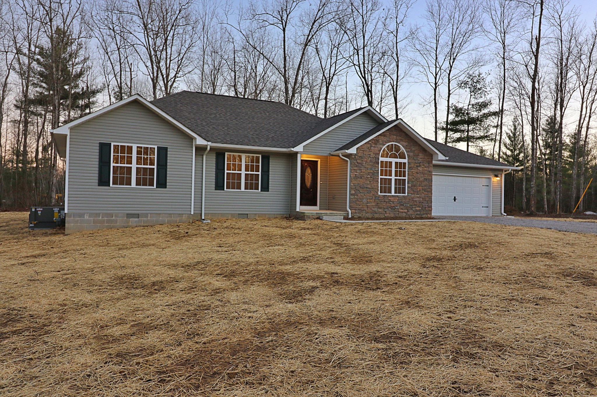 971 Toomey Falls Road Oneida, TN 37841 - Photo 16 of 16 a front view of a house with a yard and garage