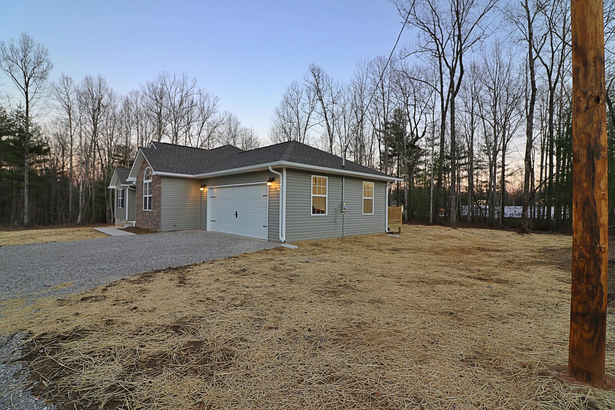 971 Toomey Falls Road Oneida, TN 37841 - Photo 3 of 16 a house with trees in front of it