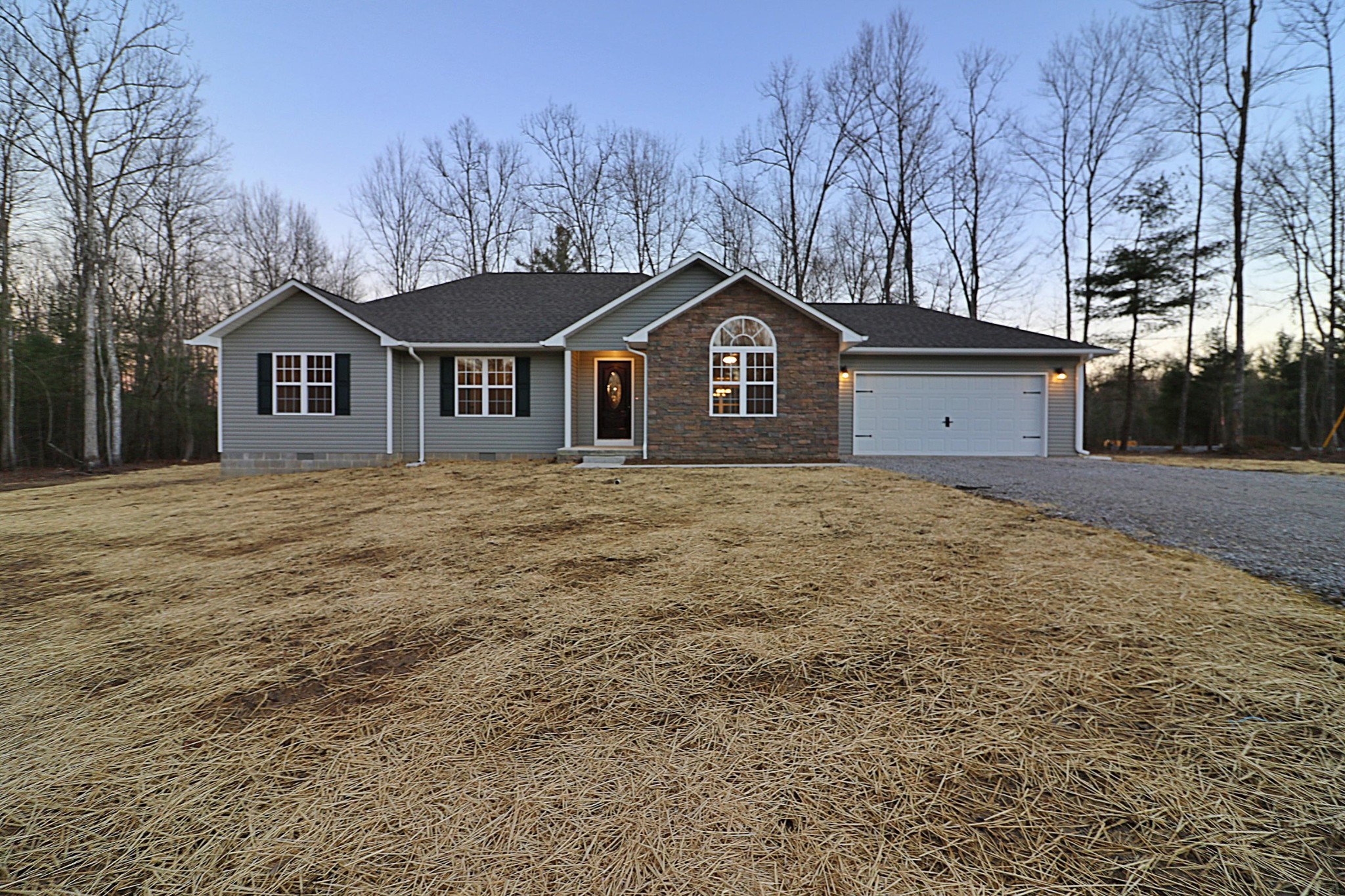 971 Toomey Falls Road Oneida, TN 37841 - Photo 8 of 16 a front view of a house with a garden