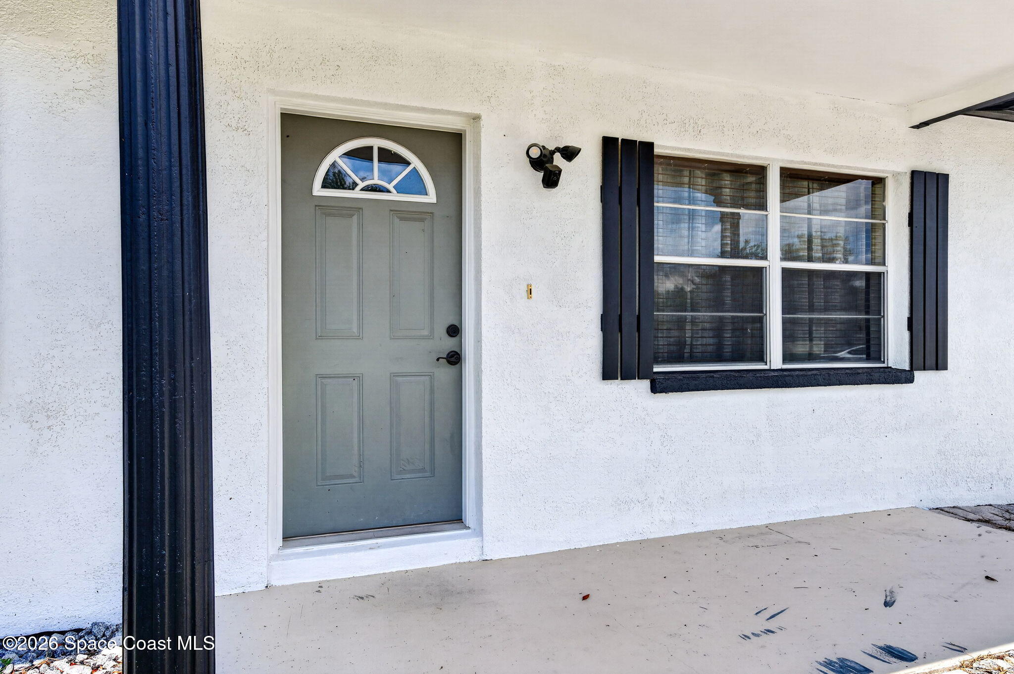 3300 Argyle Road Titusville, FL 32796 - Photo 5 of 29 a view of an empty room with wooden floor and a window