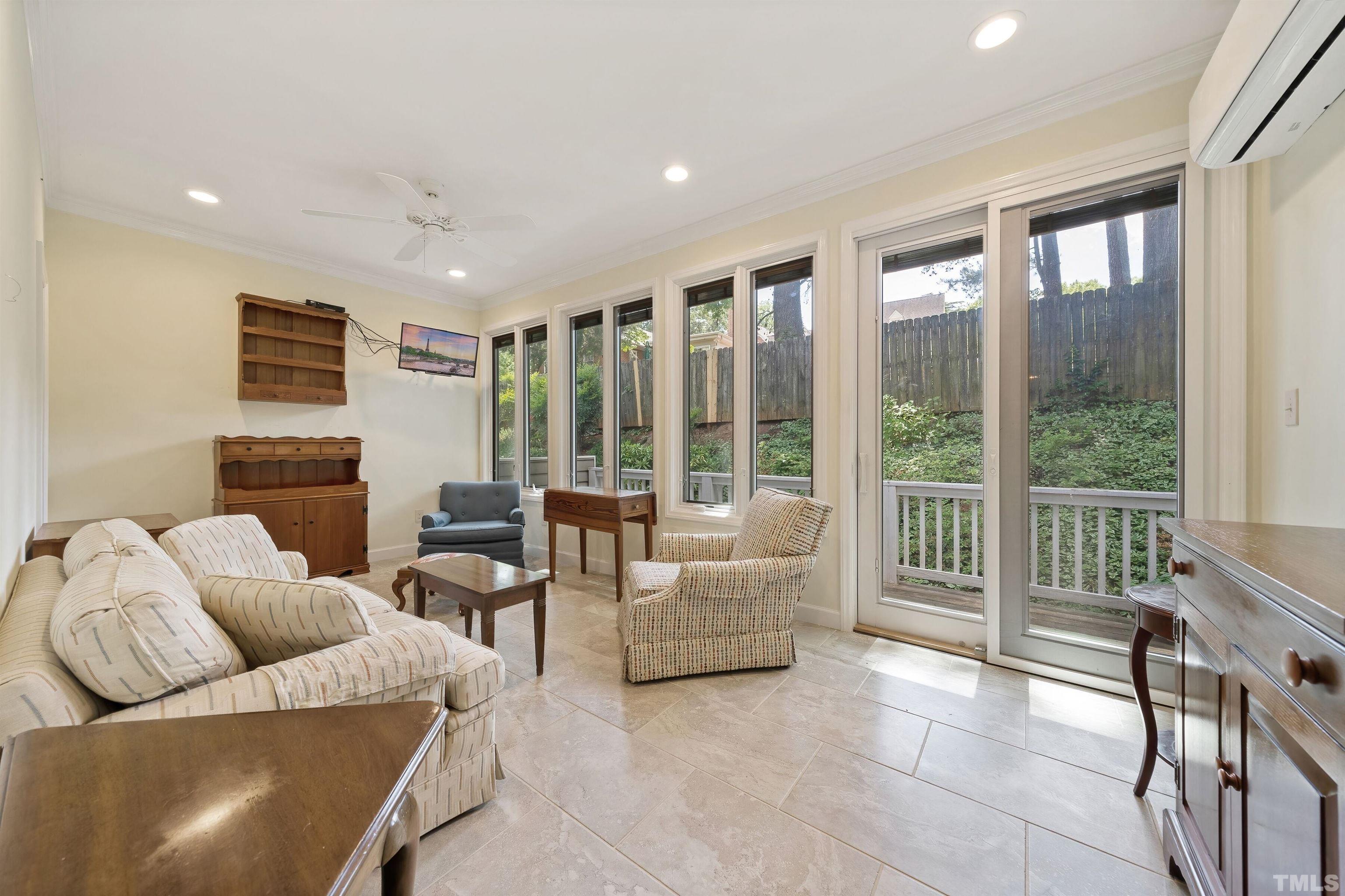 2623 Ashland Street Raleigh, NC 27608 - Photo 16 of 18 a living room with furniture and a large window