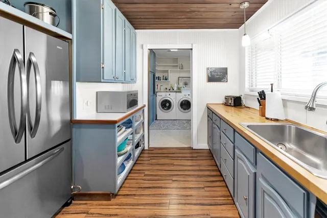 a kitchen with stainless steel appliances granite countertop a stove and a refrigerator