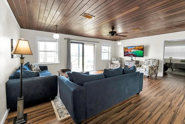 a living room with furniture and a rug