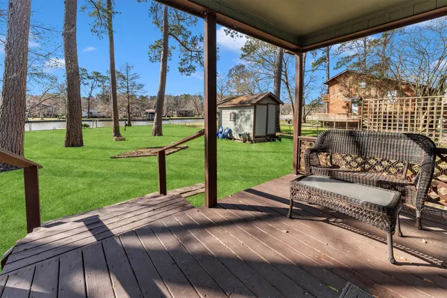 a view of a park with furniture and garden