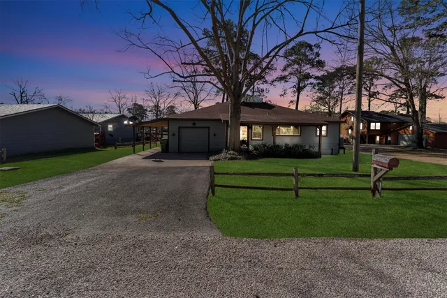 a view of house with backyard
