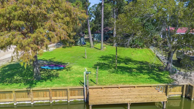 a view of a lake with a big yard