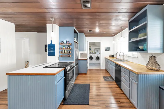 a view of a livingroom with furniture and wooden floor