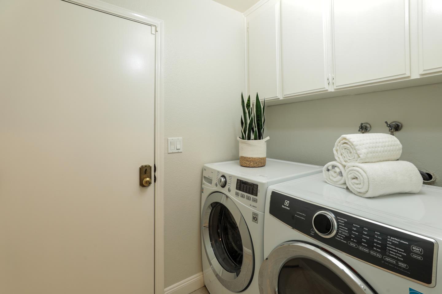 2307 Cresthaven Street Milpitas, CA 95035 - Photo 20 of 24 a utility room with dryer and washer