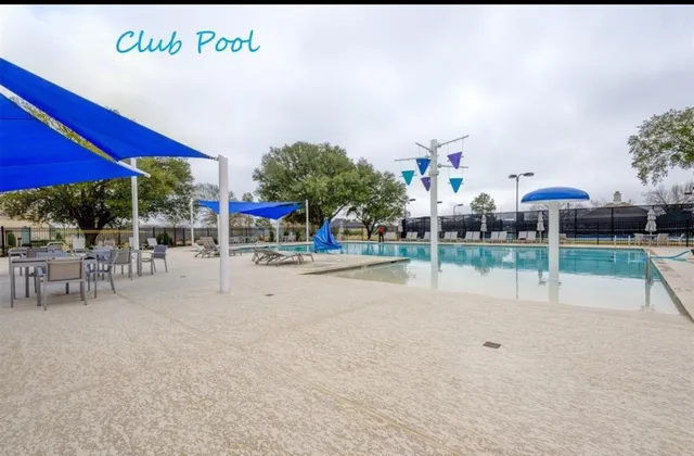 a front view of a house with a big yard
