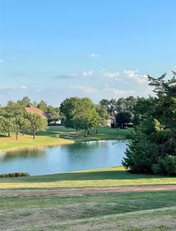 a view of a lake with a big yard