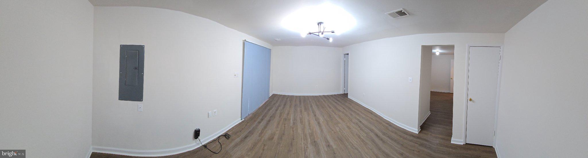 809 St Michaels Drive Bowie, MD 20721 - Photo 6 of 17 wooden floor in an empty room with a window