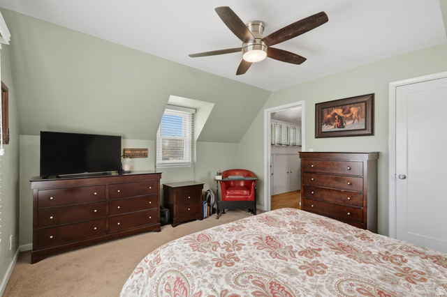 7576 South Jefferson Street Midvale, UT 84047 - Photo 26 of 53 Carpeted bedroom featuring a sloped ceiling and a ceiling fan with integrated lighting