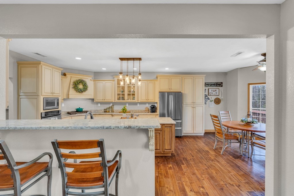 700 Falls Road Monterey, TN 38574 - Photo 14 of 72 a kitchen with stainless steel appliances granite countertop a sink and a refrigerator