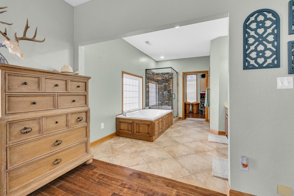 700 Falls Road Monterey, TN 38574 - Photo 21 of 72 a spacious bedroom with a bed and a dresser