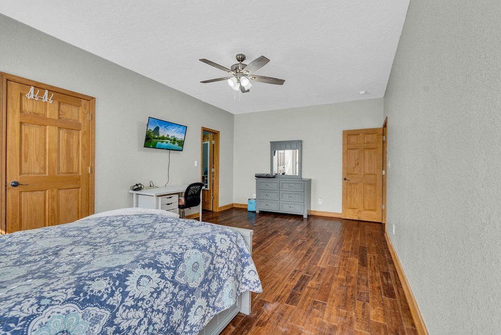 700 Falls Road Monterey, TN 38574 - Photo 26 of 72 a bedroom with a bed and a chandelier