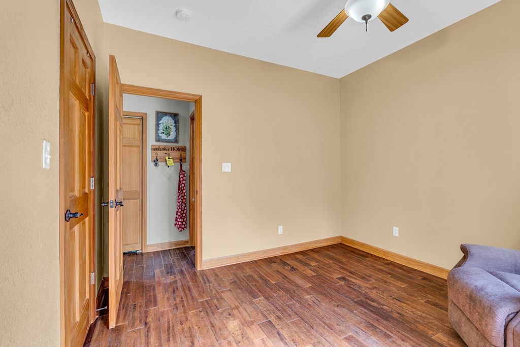 700 Falls Road Monterey, TN 38574 - Photo 30 of 72 a view of a room with wooden floor and a ceiling fan