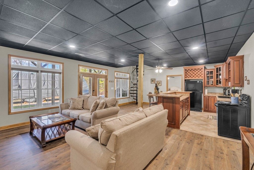 700 Falls Road Monterey, TN 38574 - Photo 42 of 69 a living room with furniture a ceiling fan and a large window