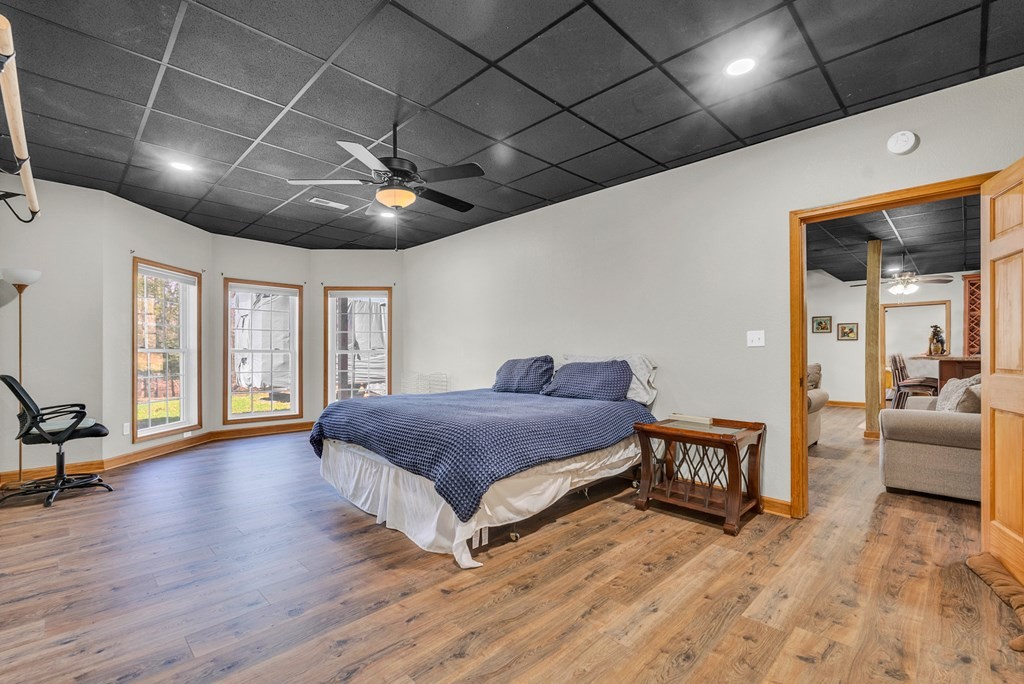 700 Falls Road Monterey, TN 38574 - Photo 47 of 69 a spacious bedroom with a bed and a wooden floor