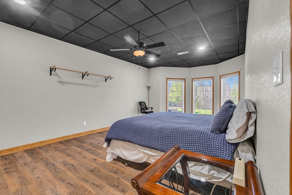 700 Falls Road Monterey, TN 38574 - Photo 48 of 69 a bed sitting in a spacious bedroom next to a window