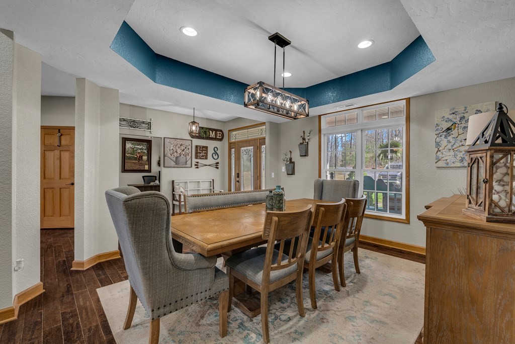 700 Falls Road Monterey, TN 38574 - Photo 5 of 72 a dining room with furniture a chandelier and wooden floor