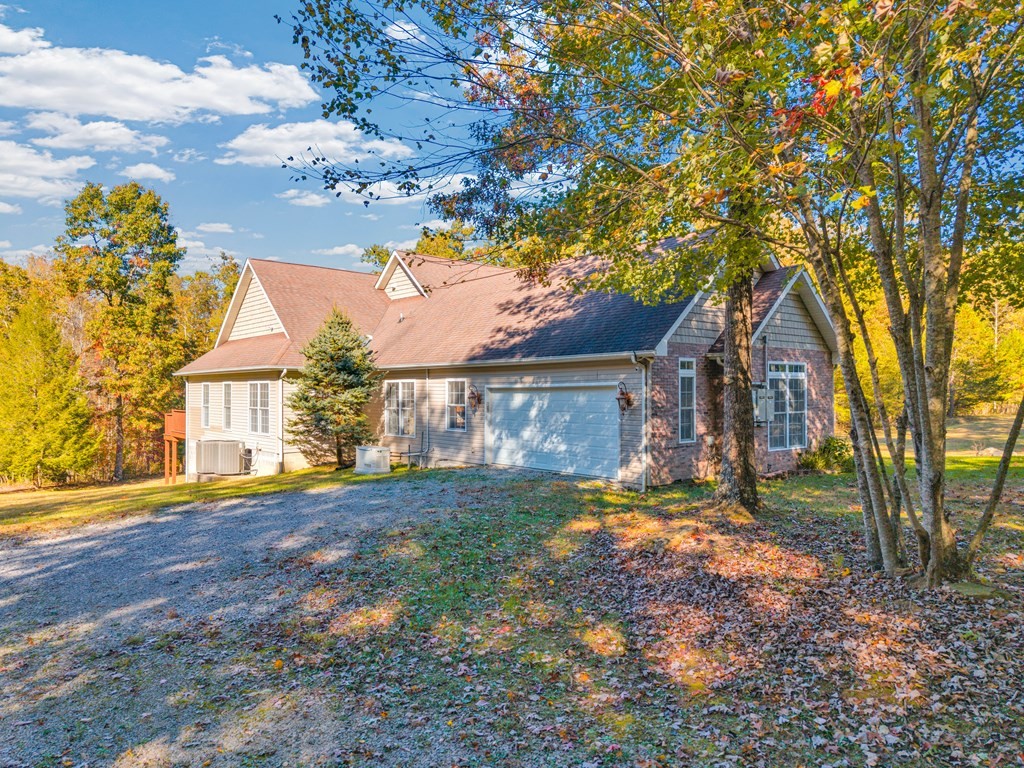 700 Falls Road Monterey, TN 38574 - Photo 60 of 69 a view of a house with a big yard and large tree