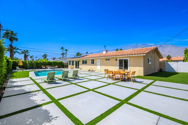 a front view of house with yard and seating