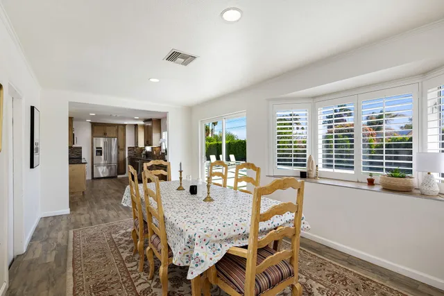 a view of a swimming pool with a yard and a swimming pool