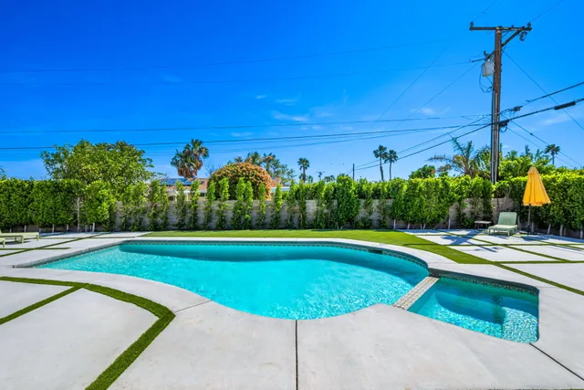 a view of an outdoor sitting area in front of a house