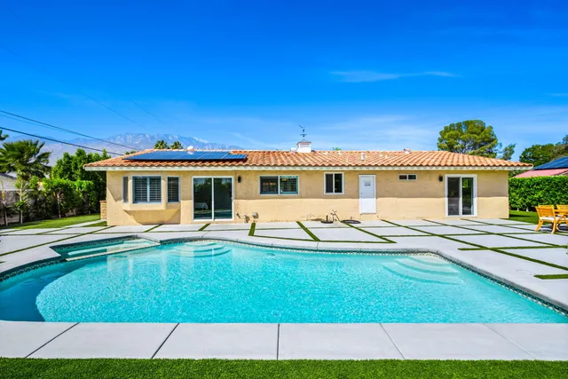 a view of a house with pool porch and wooden floor
