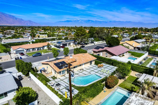a front view of a house with a swimming pool