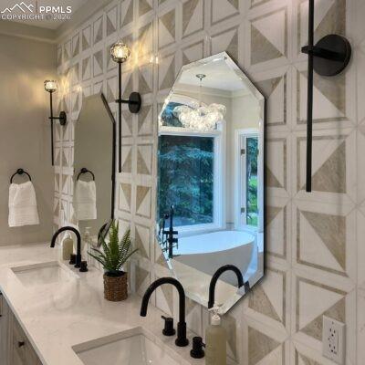 5499 Remuda Rnch Parkway Sedalia, CO 80135 - Photo 11 of 19 a bathroom with a sink and a mirror