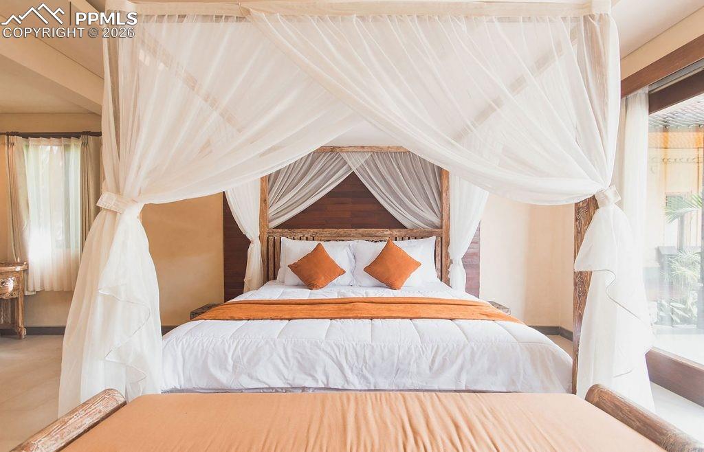 5499 Remuda Rnch Parkway Sedalia, CO 80135 - Photo 4 of 19 a bedroom with a bed and a painting on the wall